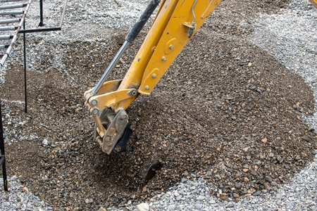 The excavator bucket extracts the pebbles.の写真素材