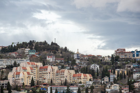 Yalta, Crimea - April 19, 2022: Embankment of the sea, high-rise buildings on the seashore.の写真素材
