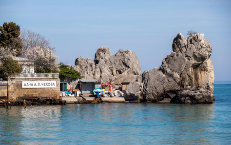 Yalta, Crimea - April 19, 2022: Embankment of the sea, high-rise buildings on the seashore.の写真素材