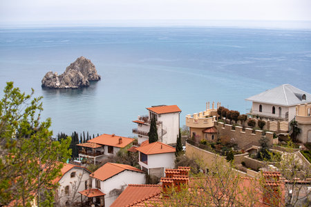 Yalta, Crimea - April 19, 2022: Embankment of the sea, high-rise buildings on the seashore.の写真素材