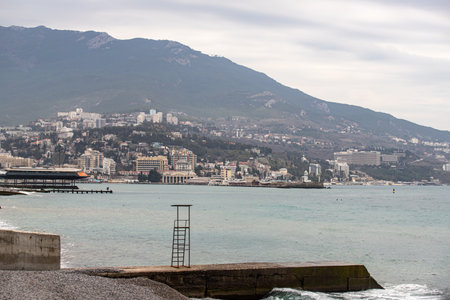 Yalta, Crimea - April 19, 2022: Embankment of the sea, high-rise buildings on the seashore.の写真素材