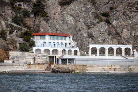 Yalta, Crimea - April 19, 2022: Embankment of the sea, high-rise buildings on the seashore.の写真素材