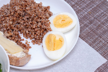 Morning breakfast, buckwheat porridge, eggs and cucumbers.の写真素材