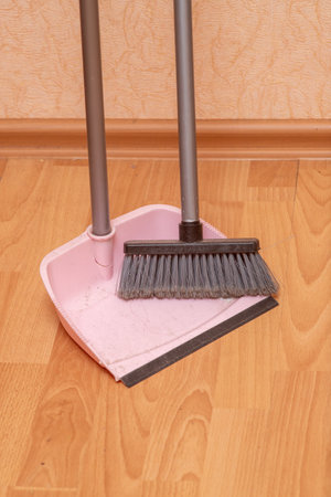Floor brush on a wooden floor.の写真素材