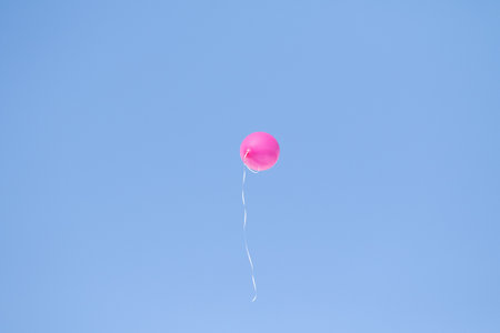rubber balloon high in the blue skyの写真素材