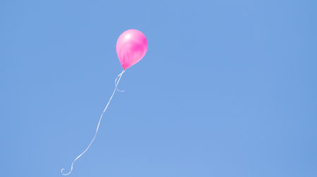rubber balloon high in the blue skyの写真素材