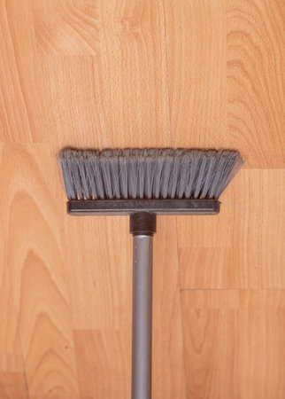 Floor brush on a wooden floor.の写真素材