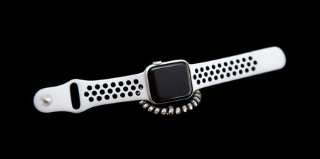 Electronic wrist watch on a black background.