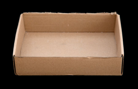 Cardboard box on a black background.の写真素材