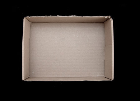 Cardboard box on a black background.