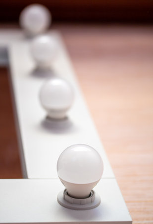 White light bulbs on the mirror in the barbershop.の写真素材