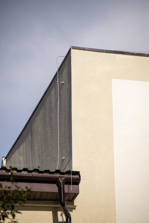 Detail of a roof of a house with a plastic roofing materialの写真素材
