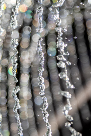 Water droplets in the air of the fountain, defocused bokehの写真素材