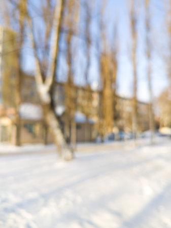 city street in winter trees houses out of focusの写真素材