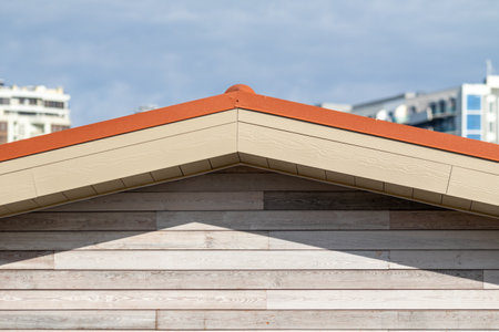 triangular roof of a house against the sky