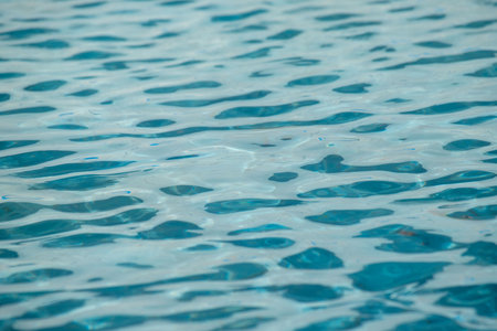 The water is calm and clear, with ripples that resemble the shape of a heart. Concept of tranquility and serenity, as if the water is a peaceful and calming presenceの写真素材