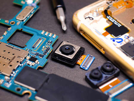 Close-up photos showing process of mobile phone repairの写真素材