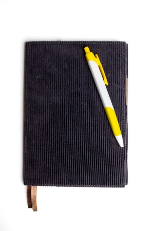 notebook and pen , isolated on white backgroundの写真素材