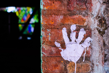 Hand prints on the brick wallの写真素材