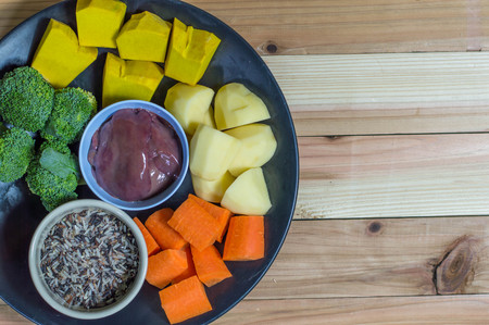 Baby food ingredient, vegetables and liver with wooden backgroundの写真素材