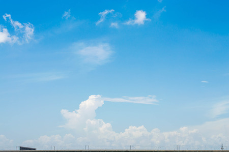 Blue sky with clouds top of expresswayの写真素材