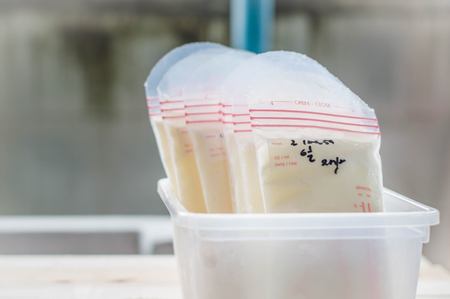 breast milk frozen in storage bags for baby with sunlight, Selective focusの写真素材
