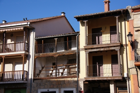 Main square, typical houses of brick and stone, Galarias wood, Arab tile roofs, seats to see the bullfights in the main square, Candeleda, Spainの写真素材