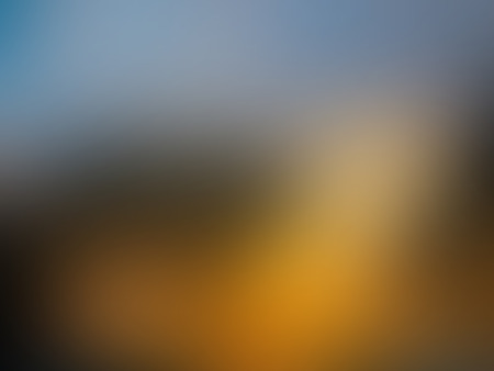 Sunset blurred background with blue, orange, grey and yellow spots texture, in vectorのイラスト素材