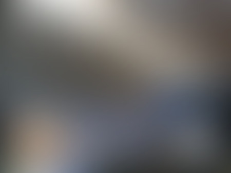 Abstract grey blurred background with lights in the left top corner and dark in the right bottom corner texture, in vectorのイラスト素材