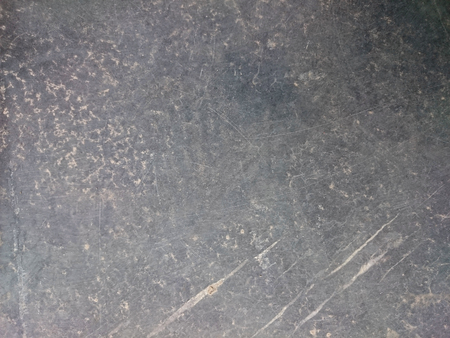 Concrete grey scratched  pattern. Grained stone background texture. Ruffle wall or floor rock.の写真素材