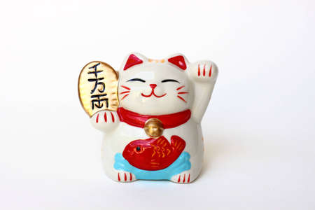 Japanese lucky cat on whiteの写真素材