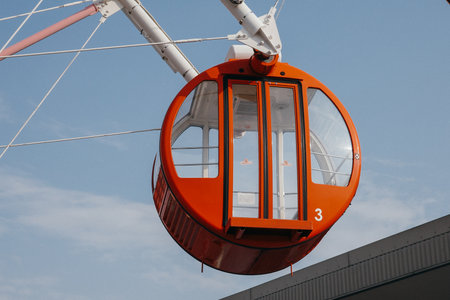 Ferris wheel on a background of blue sky, close-upの写真素材