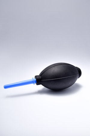 Hand Air Blower. Shot on a white background. Used to clean electronics and cameras from dust.の写真素材