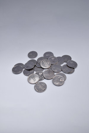 Pile of Indonesian thousand rupiah coins isolated on a white background