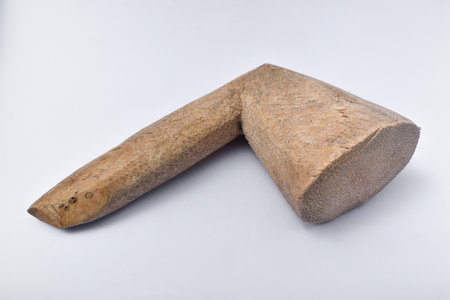 Wooden pestle (Cobek and Ulekan) isolated on a white background. Is a typical Indonesian kitchen utensil to make chili sauce or cooking spicesの写真素材