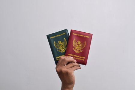 Hands holding Marriage Book, Husband and Wife, Ministry of Religion of the Republic of Indonesia...