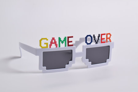 Party or birthday glasses that say "Game Over" on white backgroundの写真素材