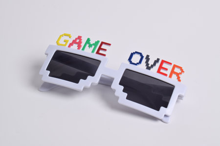 Party or birthday glasses that say "Game Over" on white backgroundの写真素材