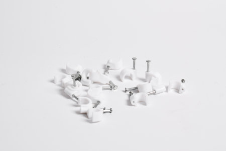 Cable nail clip, Plastic cable clips with steel nails isolated on white backgroundの写真素材