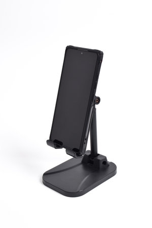 Phone holder stand that can be adjusted to height angle isolated on white background. holder for phone, phone stand, mount, universalの写真素材