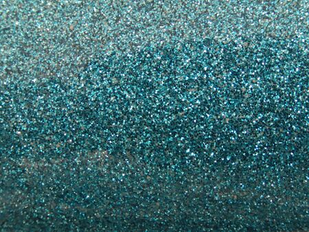 Background texture: sparkling vivid turquoise blue glitterの写真素材