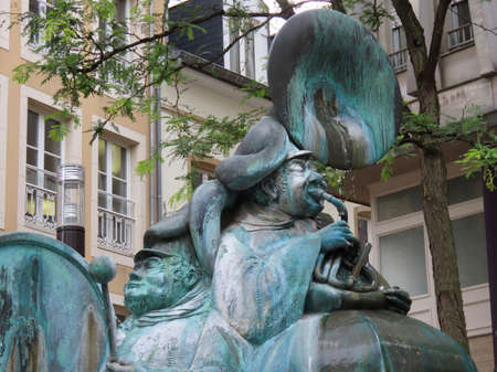 Luxembourg, Luxembourg - August 8, 2019. Green copper sculpture with dancing musicians and happy sheep - modern fountain in place of medieval Red well Roude Petz in old town, famous meeting pointのeditorial素材
