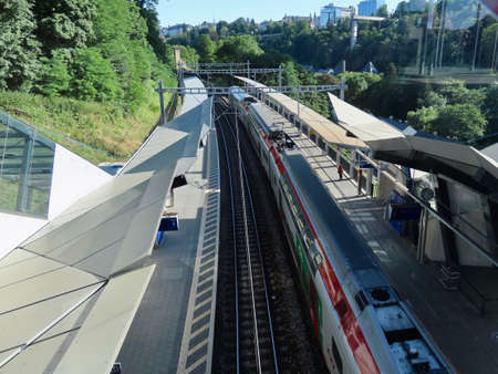 Luxembourg, Luxembourg - July 4, 2019. Public transport in city. Passengers waiting for commuter...
