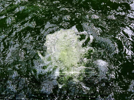 Water splashing in basin - photo for background texture
