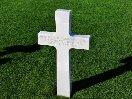 A single white cross for unknown soldier Here rests in honored glory a comrade in arms known but to God at American military cemetery in Sandweiler, Luxembourg, October 31, 2020のeditorial素材