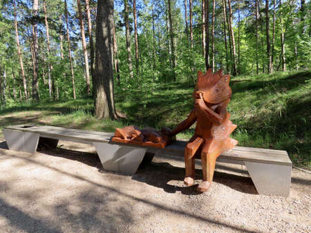 Wooden sculpture - hedgehog mother with sleeping babies - in protected nature area of White dune in Saulkrasti, Latvia - May 30, 2021のeditorial素材