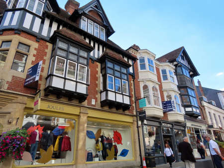 Medieval houses and narrow High street of old town in Winchester, England - September 20, 2021