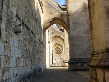 Nice walkway under flying buttresses of Winchester cathedral, England, UKの写真素材