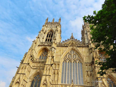 West facade with great stained glass mosaic window of York cathedral, England, UK