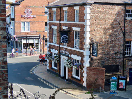 Street view from Monksbar Gate of old town in York, England - September 8, 2021. Double Tree Hilton...